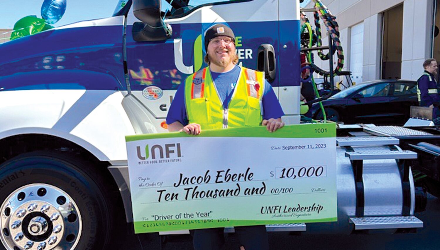 Jacob Eberle was one of four United Natural Foods associates selected as a 2023 Elite Driver of the Year as part of the company’s Driver Ambassador Program. This photo of Eberle and a check for $10,000 was provided by the company.